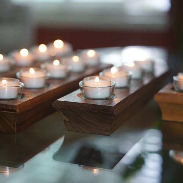 Any size wooden candle holder. Is Reversible! Great for any occasion. Made of Walnut. Can be used to light Shabbat Candles.