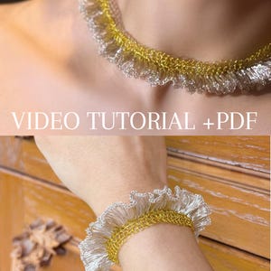 May include: A crocheted choker and matching bracelet set featuring a metallic gold base with a ruffled silver edge. The image includes the text VIDEO TUTORIAL + PDF, indicating that instructions for creating these items are provided.