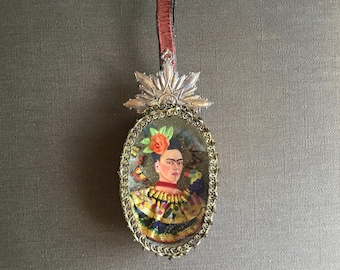 Hanging diorama of Frida Kahlo, consisting of a papier-mache box with a clear pane in front