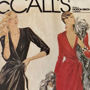 May include: Vintage McCall's sewing pattern featuring illustrations of two women in elegant wrap dresses. One dress is black, the other is red. The pattern includes the text "McCall's" at the top.