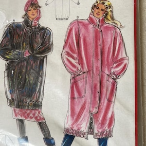May include: Illustration of two long coats. One is black with a pink and purple pattern, and the other is a solid pink. Both coats have large pockets and a high collar. The illustration is on a pattern envelope.