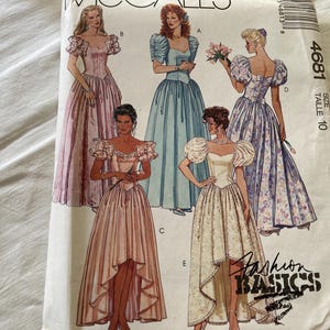 May include: A McCall's 4681 sewing pattern envelope for size 10, featuring illustrations of five different floor-length gowns with puff sleeves, sweetheart necklines, and varying skirt styles, including high-low hemlines and full-length designs.