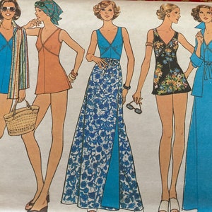May include: A vintage sewing pattern envelope illustration featuring five figures wearing various blue, orange, and floral-patterned swimsuits, wrap skirts, and coordinating jackets. The artwork displays diverse summer outfits including a long blue gown and a floral romper, with the text Size 12 1/2 visible in the upper right corner.