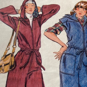 May include: Two women's jumpsuits, one in a deep red color with a hood and a brown shoulder bag, and the other in a light blue color with a plaid shirt underneath.