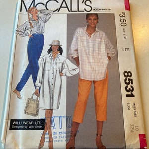 May include: A McCall's sewing pattern envelope, number 8531, featuring illustrations of three outfits: a striped shirt with blue pants, a white shirt dress with a hat, and a plaid shirt with orange cropped pants. Includes Willi Wear Ltd. branding.