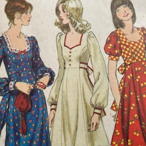 Może przedstawiać: Wzór na sukienkę w stylu vintage z trzema różnymi wzorami sukienek. Jedna sukienka jest niebieska z kwiatowym nadrukiem, druga kremowa z czerwonymi wykończeniami, a trzecia czerwona z żółtym kwiatowym wzorem i kratkowym stanikiem.