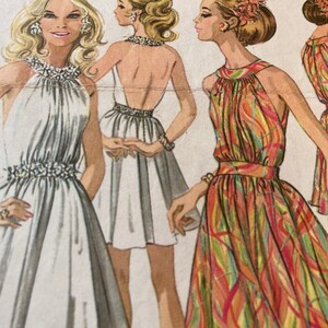 May include: Illustration of four women in vintage halter dresses. The dresses are in white, and a colourful abstract pattern. The dresses have embellished necklines and waistlines. The image is a fashion illustration.