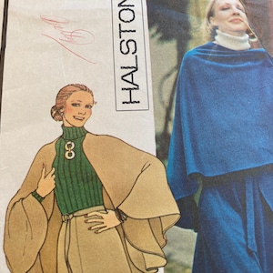 May include: Vintage fashion illustration featuring a woman in a tan cape and green turtleneck sweater. The image also shows a woman in a blue cape. The word "HALSTON" is visible. The illustration is from a vintage sewing pattern.