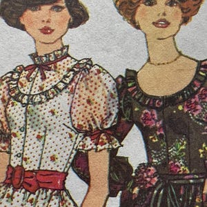 May include: Two women wearing vintage style dresses with floral patterns. The woman on the left is wearing a white dress with red polka dots and a red bow. The woman on the right is wearing a brown dress with a floral pattern.