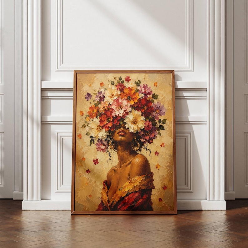 Black woman wall art featuring an elegant female portrait surrounded by a dramatic crown of colorful flowers in red, orange, cream and purple tones. Textured painterly artwork with a warm neutral background and rich botanical details. Perfect as floral woman art, feminine wall decor, African American art, boho portrait, bedroom artwork, living room decor or a colorful statement piece for a modern gallery wall.