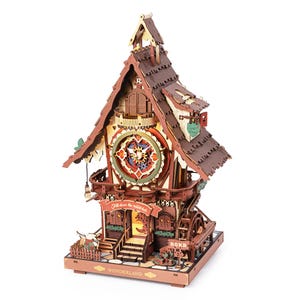 May include: A wooden model clock house featuring a large central clock face, a water wheel on the side, and intricate architectural details. The structure includes a banner reading "Fall down the rabbit hole" and a base labeled "WONDERLAND" with ROKR branding.