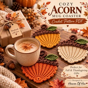 May include: A crochet pattern PDF for a Cozy Acorn Mug Coaster. The image displays three handmade acorn-shaped coasters in orange, yellow, and cream, each with a brown textured cap and a small green leaf. A ceramic mug sits on one coaster.