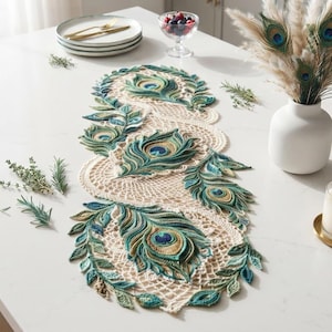 May include: A long, rectangular crochet table runner featuring an intricate cream-coloured lace base adorned with repeating peacock feather motifs in vibrant shades of teal, emerald green, gold, and deep blue, arranged in a flowing, organic pattern.