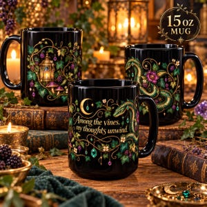 May include: Three black 444 ml ceramic mugs featuring intricate illustrations of green vines, purple berries, and a glowing lantern. One mug displays the gold text, Among the vines, my thoughts unwind, alongside a crescent moon and a serpent design.