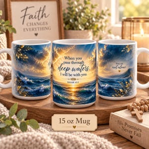 May include: Three white ceramic mugs featuring a vibrant ocean sunset scene with golden clouds and crashing waves. The center mug displays the text: When you pass through deep waters, I will be with you. Isaiah 43:2. A label reads 15 oz Mug.