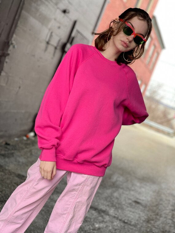 pink crewneck sweater