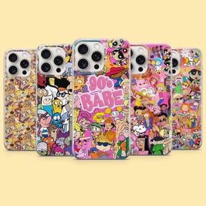 May include: Five smartphone cases featuring colourful collage prints of various 1990s and 2000s cartoon characters. The centre case displays the text 90's BABE in pink lettering. Each case has a camera cutout and a clear protective shell design.