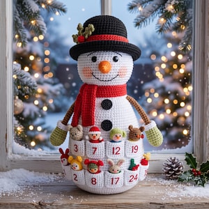 May include: A white crocheted snowman advent calendar featuring a black hat with holly, a red scarf, and two black buttons. The snowman has pockets numbered 3, 7, 12, 19, 2, 8, 17, and 24, each containing a small crocheted animal or holiday figure.