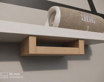 May include: A white floating shelf with a light oak wood bracket support underneath. A beige JBL portable speaker sits on top of the shelf. The image includes a graphic icon with the text 16 mm THICKNESS, indicating the shelf board depth.
