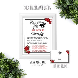 May include: A white framed print with the text "Place your Bets" and "All Bets &pound;5". The print features instructions on how to play, a horse racing graphic, and red rose decorations. A bet slip is also included.