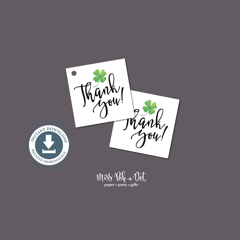 May include: Two white square tags with a green shamrock and the words "Thank you!" in black script. The tags are on a gray background. The image also includes a blue circle with the words "Instant Download" and "Receive Immediately".