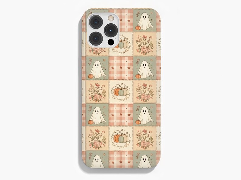 May include: A smartphone case featuring a repeating grid pattern of soft-toned squares. The design includes illustrations of white ghosts, orange and blue pumpkins, floral bouquets, and plaid squares with small stars in muted shades of peach and sage.