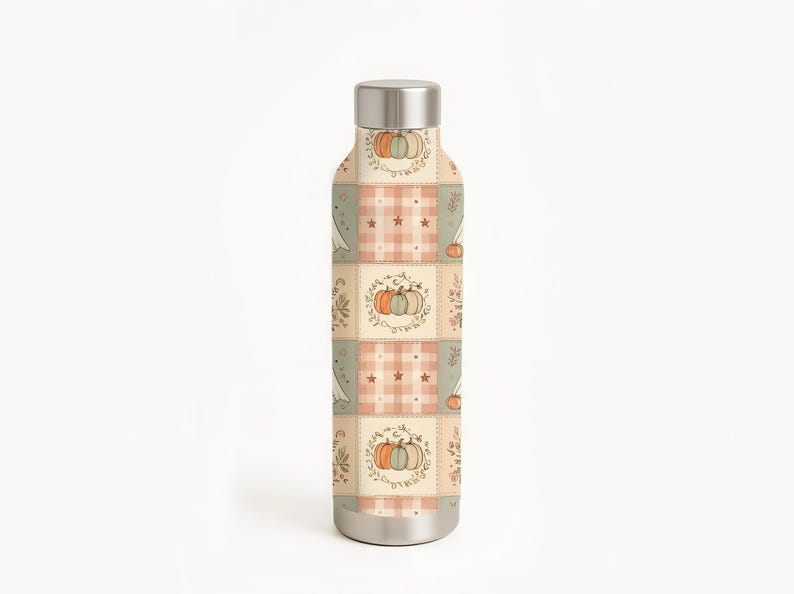 May include: A cylindrical metal water bottle with a silver cap and base. The body features a repeating patchwork pattern of cream, sage green, and soft orange squares decorated with illustrations of pumpkins, small stars, and leafy foliage.