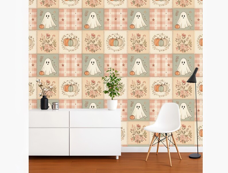 May include: Wallpaper featuring a repeating grid pattern of alternating squares. One set of squares displays white ghosts with orange pumpkins on a plaid background, while the other set shows floral arrangements with pumpkins in muted earth tones.