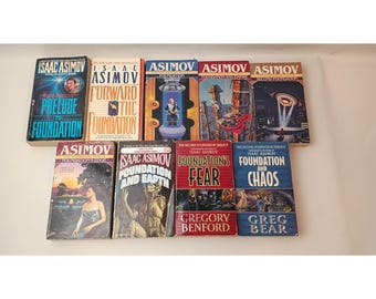 Lot de 9 livres de la série Fondation d'Isaac Asimov (éditions de poche), dont 7 originaux et 2 autres.