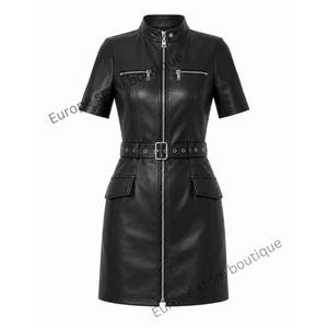 May include: A black short-sleeved dress featuring a full-length silver front zipper, a stand-up collar, two horizontal zippered chest pockets, and a matching waist belt with a silver buckle and eyelets. The dress includes two flap pockets at the hips.