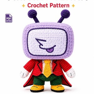 May include: A crochet pattern for a Mr. Ant Tenna doll. The doll has a purple television-shaped head with antennae, a red jacket, a yellow tie, green pants, and yellow shoes. The screen features a stitched face with a purple tongue sticking out.