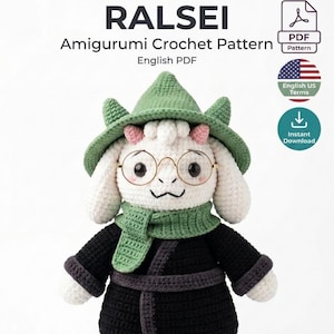 May include: A Ralsei amigurumi crochet pattern PDF featuring a white crocheted character with a green hat, green scarf, and black robe. The character wears round gold-rimmed glasses and has small pink horns. Text includes RALSEI Amigurumi Crochet Pattern English PDF, English US Terms, and Instant Download.