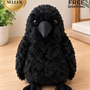 May include: A plush toy shaped like a crow with soft black fur, a pointed black beak, and small dark eyes. The bird has a rounded body and detailed feet, standing upright with a textured appearance that mimics feathers in a dense, dark coat.