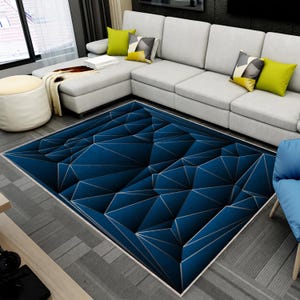 May include: A rectangular area rug featuring a deep blue geometric pattern composed of interconnected triangles and sharp lines. The design creates a three-dimensional effect with varying shades of blue and dark grey outlines across the surface.