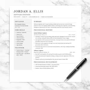 May include: A professional resume template for a software engineer named Jordan A. Ellis, featuring sections for education, core skills, professional history, and development, accompanied by a black ballpoint pen resting on the document.