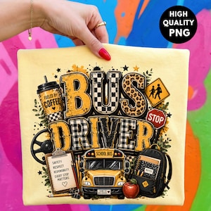 May include: A light yellow t-shirt featuring a graphic design with the text BUS DRIVER. The design includes a coffee cup, a school bus, a backpack, a clipboard with text, a steering wheel, and a stop sign. The text on the clipboard reads SAFETY RESPECT RESPONSIBILITY EVERY STOP MATTERS.