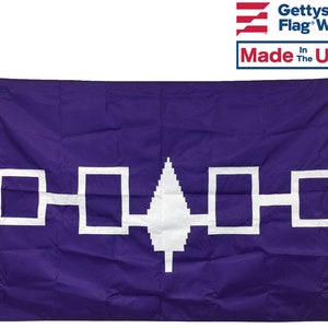 May include: Purple flag with a white stylized tree and four white squares connected by lines. The flag is made in the USA.