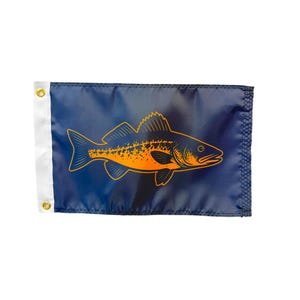 May include: A navy blue flag featuring an orange illustration of a fish. The fish is detailed with fins, scales, and a pointed head. The flag has a white border on the left side with a gold grommet for hanging.