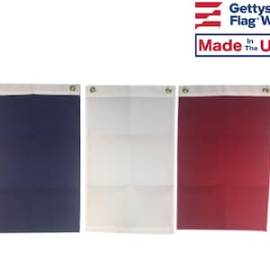 May include: Three rectangular flags with grommets. The flags are navy blue, white, and red. The flags are made in the USA by Gettysburg Flag Works.