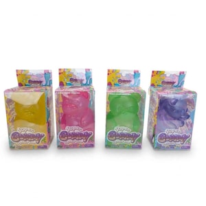 May include: Four Super Gummy Squishy Bear toys in individual clear plastic boxes. The bears are translucent yellow, pink, green, and purple. Each box features colorful graphics and the text Super Gummy Squishy Bear on the front panel.