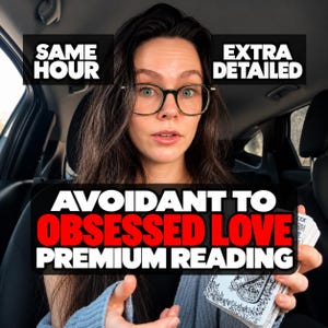 May include: A person with long dark hair and glasses holding a deck of cards. Text overlays read SAME HOUR, EXTRA DETAILED, and AVOIDANT TO OBSESSED LOVE PREMIUM READING. The person wears a gray sweater and is positioned inside a vehicle.