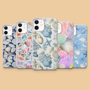 May include: Five smartphone cases arranged in a row, each featuring a unique pattern of seashells, starfish, and coral in various colors including blue, pink, white, and tan, set against backgrounds of dark blue, light gray, and light blue.