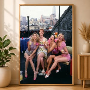 May include: A framed wall art print featuring four individuals sitting on a rooftop terrace with a city skyline in the background. They are laughing and holding drinks. The text JHAG STUDIO DIGITAL DOWNLOAD is visible in the lower center area.
