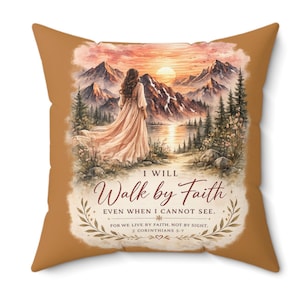 May include: A square throw pillow with a solid tan background featuring a central illustration of a person standing before mountains at sunset. The text reads: I WILL Walk by Faith EVEN WHEN I CANNOT SEE. FOR WE LIVE BY FAITH, NOT BY SIGHT, 2 CORINTHIANS 5:7.