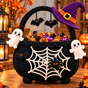 May include: A black crocheted cauldron basket featuring a white spiderweb, a black spider, two white ghost figures, and two hanging black bats. A purple witch hat with an orange band sits on the handle, and the basket is filled with colorful candies.