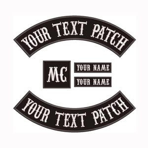 May include: A set of black embroidered patches featuring two curved rocker patches with the text YOUR TEXT PATCH, a square patch with the letters MC, and two rectangular patches with the text YOUR NAME in white, stylized serif lettering.