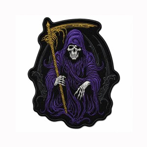 May include: An embroidered patch featuring a grim reaper figure wearing a purple hooded robe. The figure has a skeletal face and hands, holding a gold-colored scythe. The design is set against a black background with a dark, ornate border.