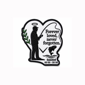 May include: A heart-shaped embroidered patch with a black border on a white background. It features a black silhouette of a person fishing with a halo above their head, a green leafy branch, a jumping fish, and the text Forever loved, never forgotten.