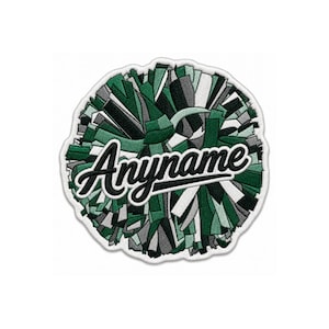 May include: A circular embroidered patch featuring a stylized pom-pom design in shades of dark green, light green, gray, and white. The word Anyname is stitched across the center in a bold, black, cursive script with a white outline.