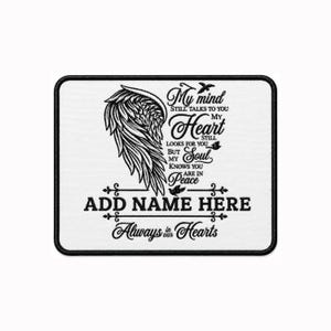 May include: A rectangular white patch with a black embroidered design featuring a large angel wing on the left. The text reads: My mind still talks to you my heart still looks for you but my soul knows you are in peace, ADD NAME HERE, Always in our Hearts.